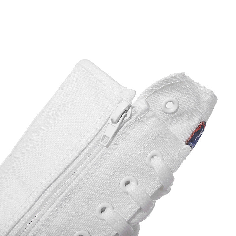 Close-up of white canvas women's lace-up mid calf sneaker with zipper detail and eyelets, perfect for a rock style look.