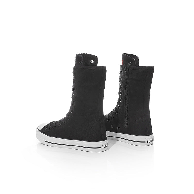 Black canvas women lace-up mid calf sneakers with rock style design and comfortable fabric for a punk look.