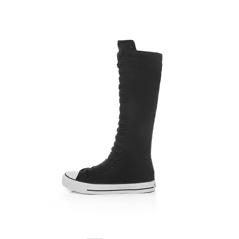 Black canvas women's lace-up mid calf sneakers for a stylish rock look. Perfect for grunge fans!