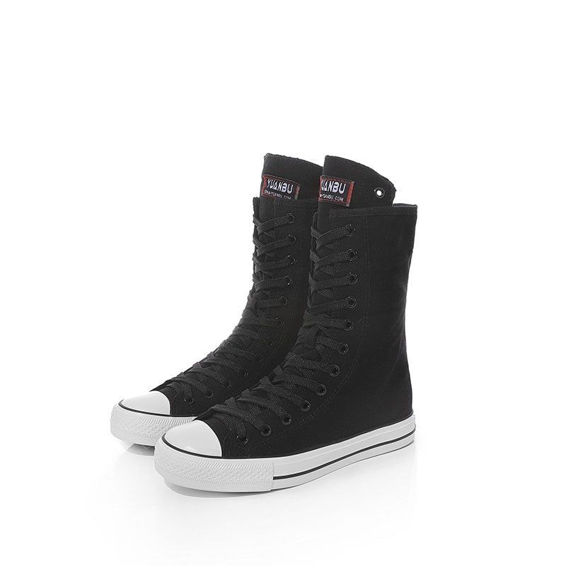 Black canvas lace-up mid-calf sneakers for women, perfect for rock style and grunge fashion.