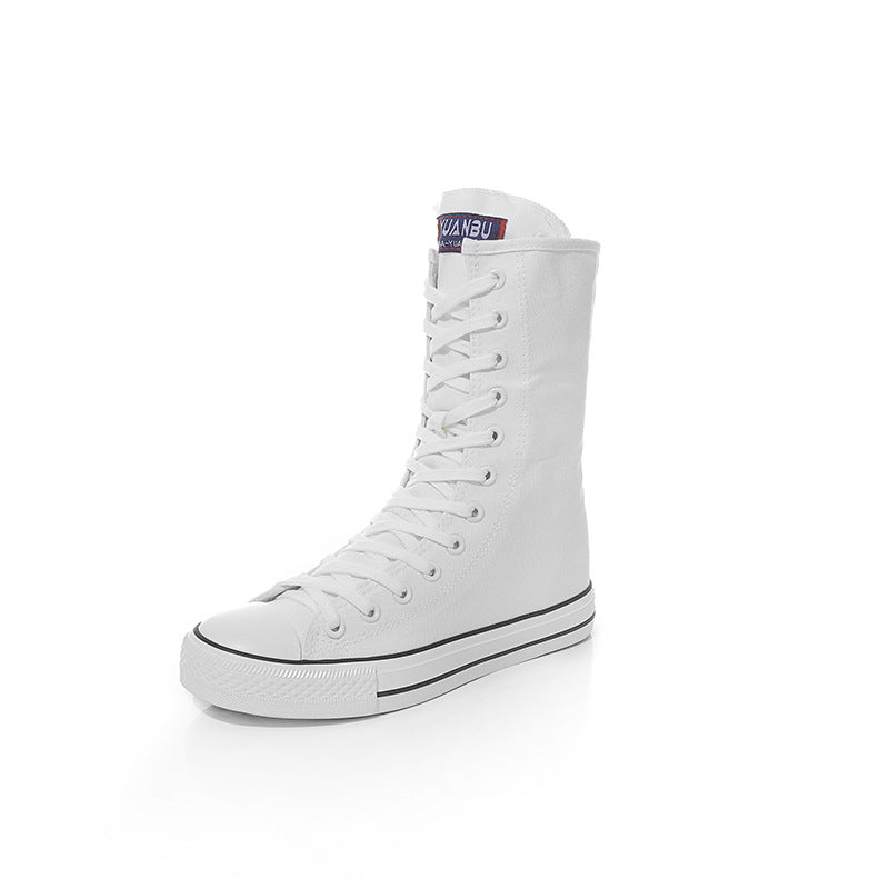 Women's white canvas lace-up mid-calf sneakers for a rock and grunge style look. Comfortable and stylish footwear choice.