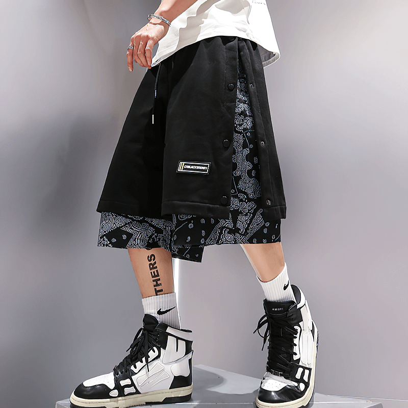 Casual male punk style drawstring shorts with graphic print, perfect for a trendy, rebellious look.