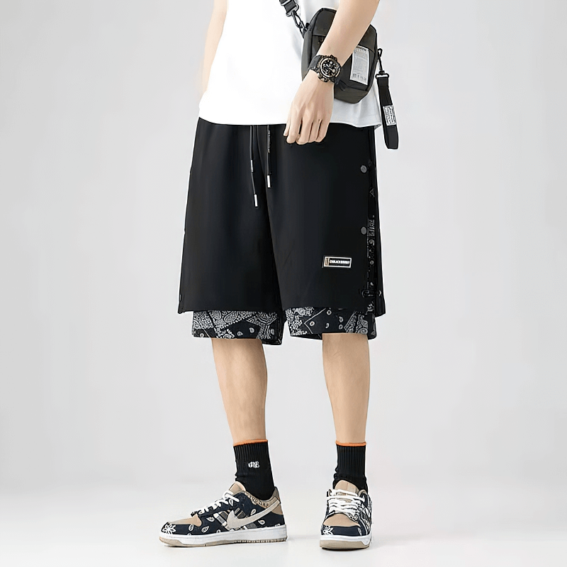 Men's punk style baggy drawstring shorts with bold print, perfect for a casual rebellious look.