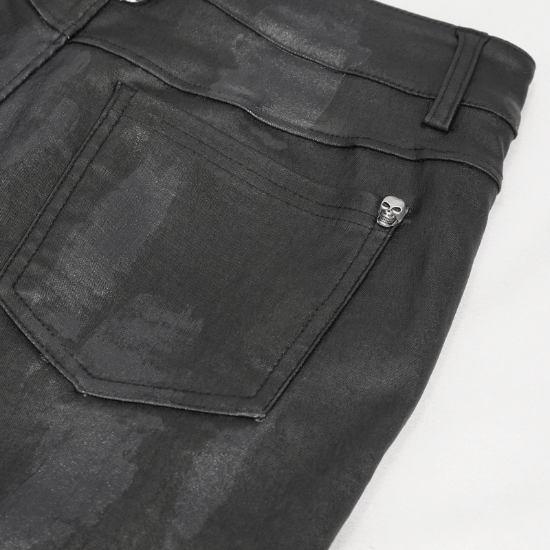 Close-up of black casual pants showcasing a decorative skull detail on the back pocket, blending punk style with elegance.