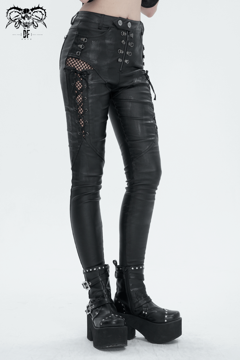 Punk-inspired women's black slim fit lace-up pants with eyelets and zipper detail, styled with platform boots.