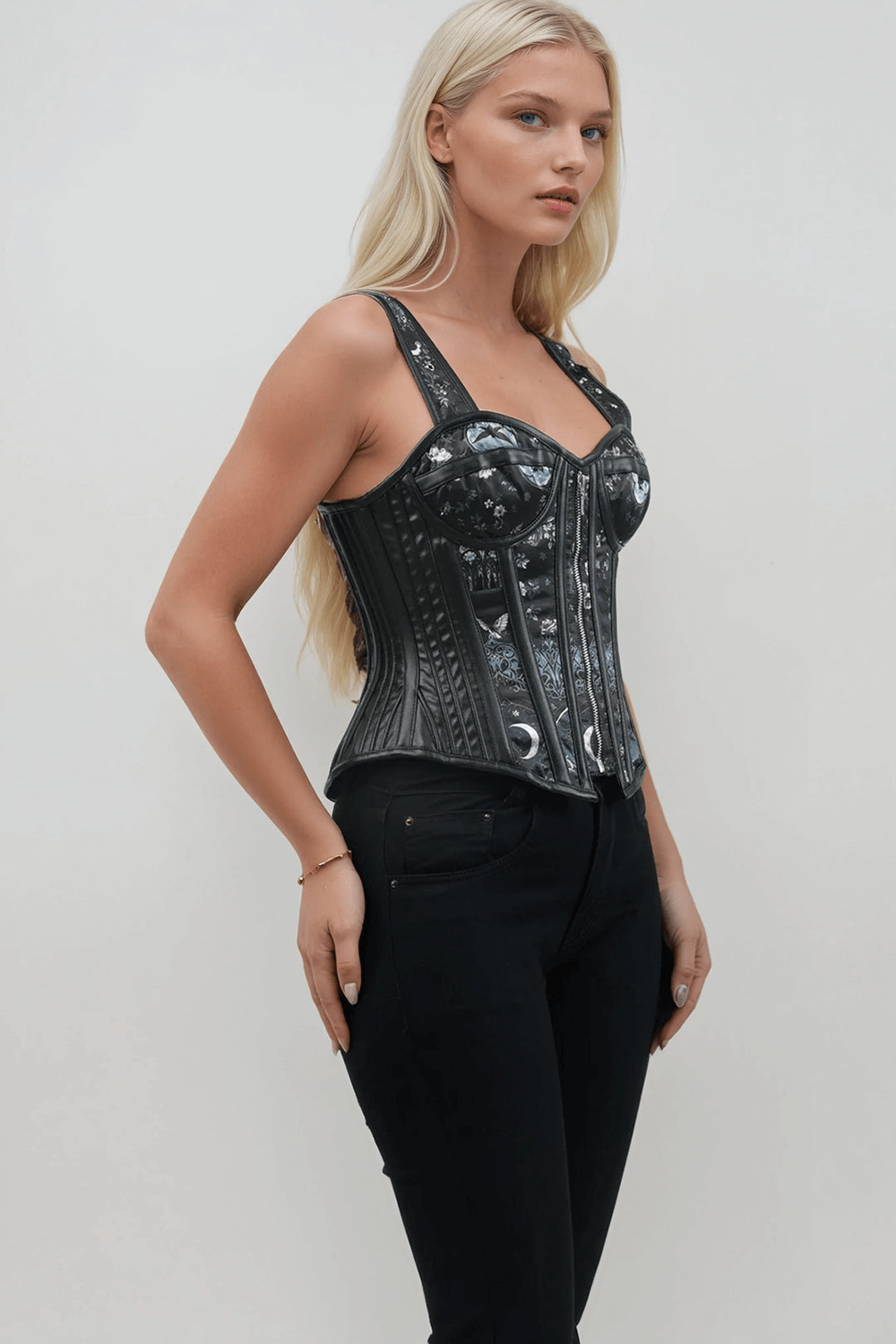 Celestial Eclipse Gothic Overbust Corset with Straps showcased by a model, featuring intricate designs and a bold silhouette.