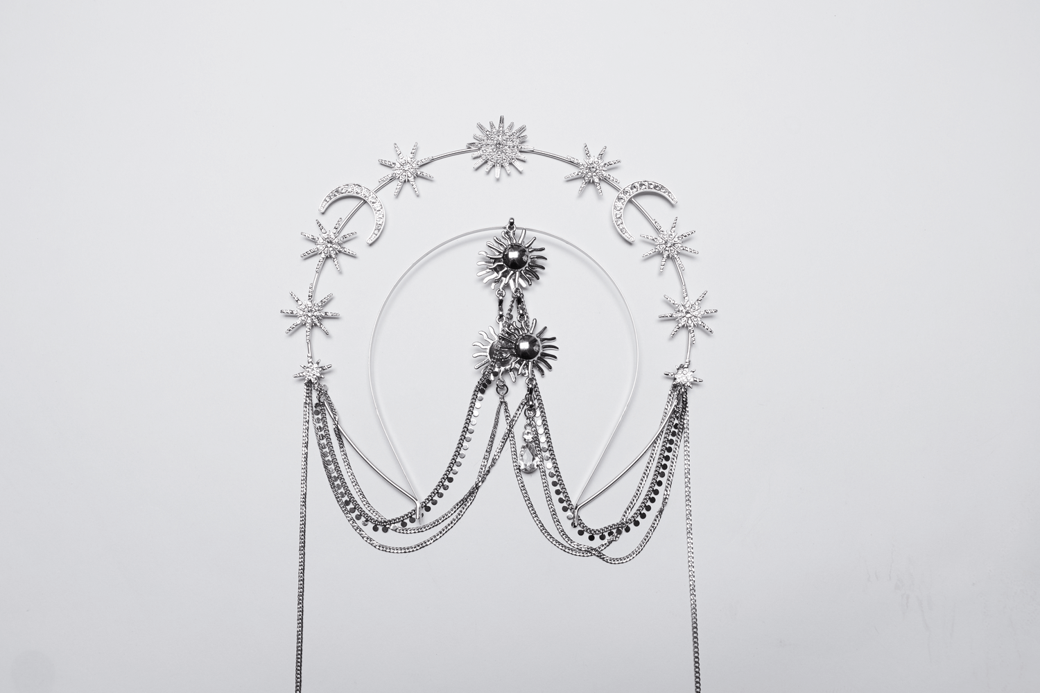 Celestial gothic headpiece featuring stars, moons, and crystal chains in silver alloy design.