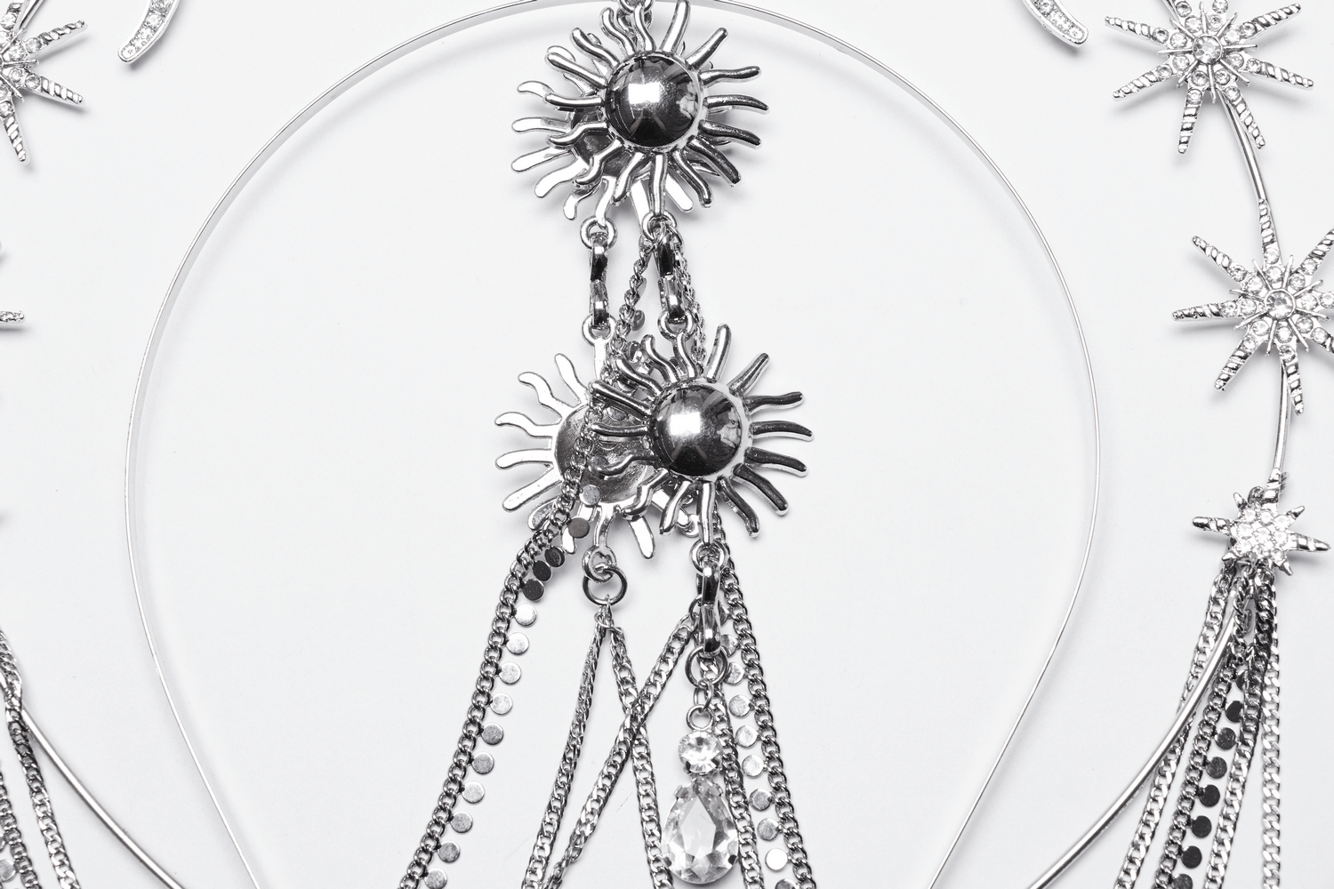 Celestial gothic headpiece featuring sun and moon designs with sparkling chains and crystal accents.