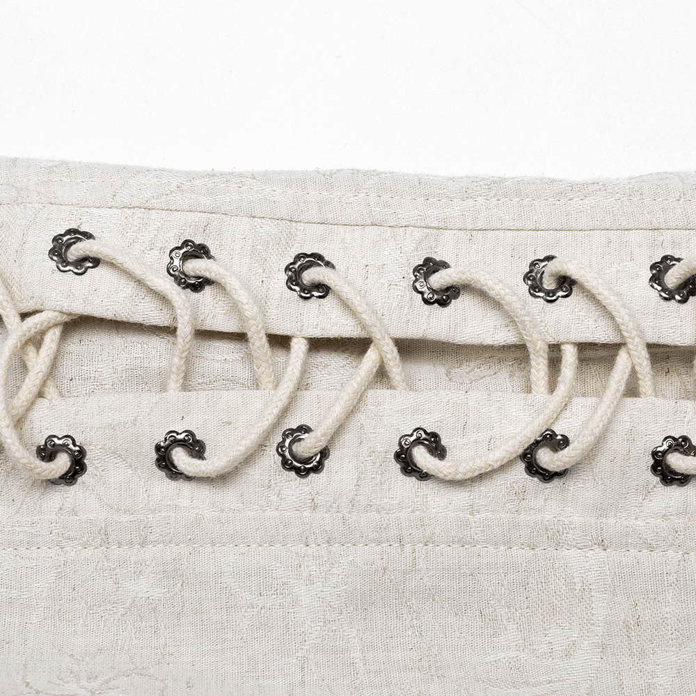 Close-up of eyelet chain detail on a gothic linen shirt, showcasing intricate craftsmanship and unique design.