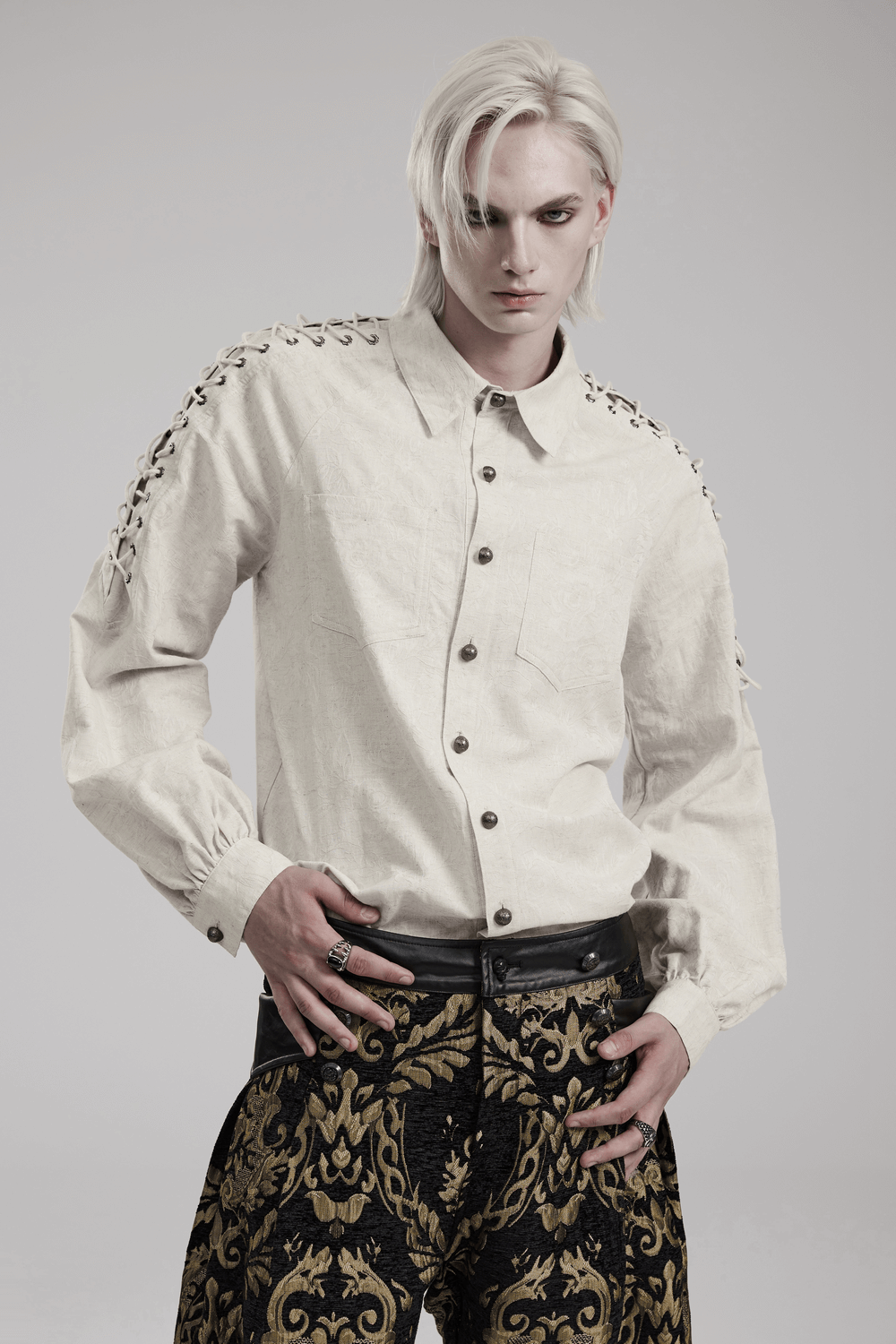 Men's gothic linen shirt with eyelet chains, dual patch pockets, and artisanal details for a unique, stylish look.