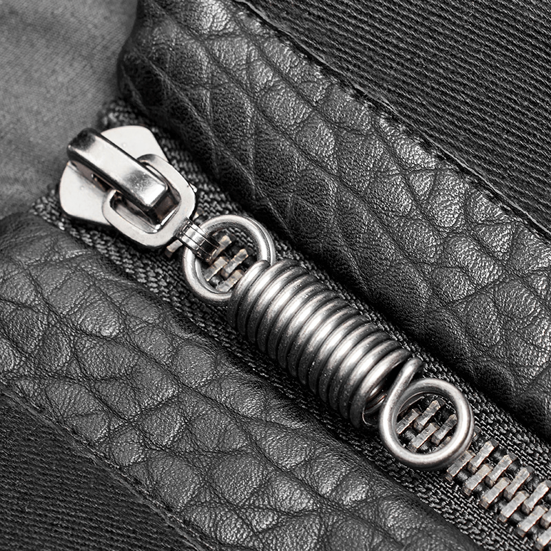 Close-up of a durable black zipper with metal pull and spiral coil, highlighting quality craftsmanship.