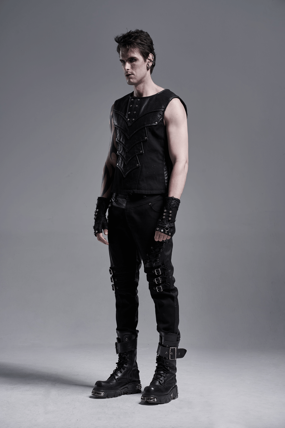 Chest protector vest with adjustable side lacing, worn by a model in a stylish black outfit.