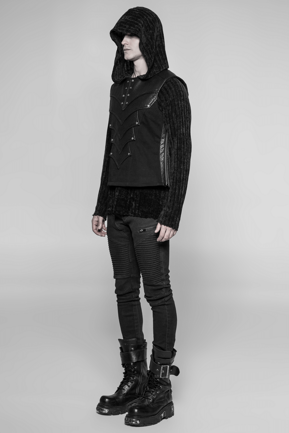 Stylish chest protector vest with adjustable lacing and zipper, worn by a male model in black fashion.