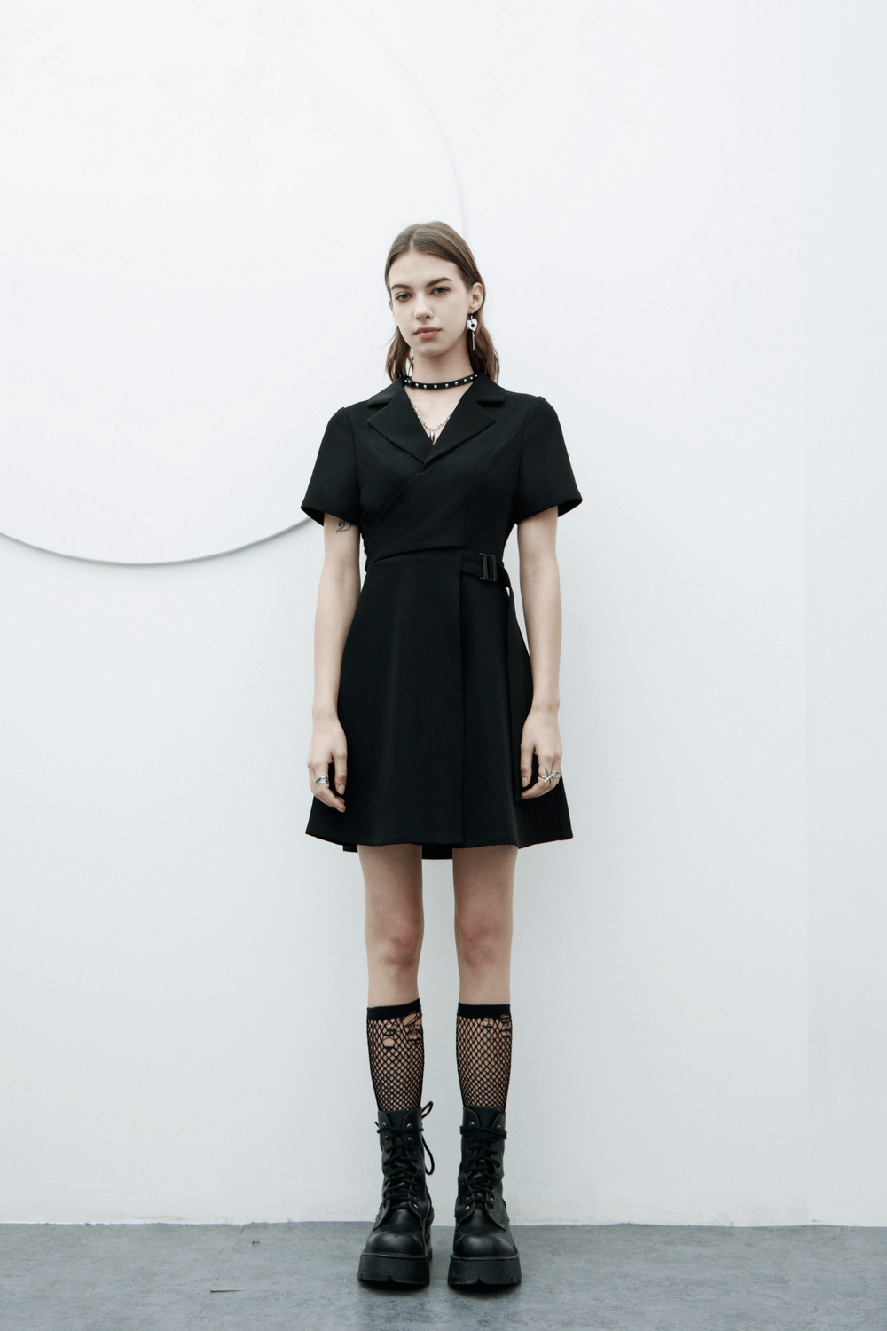 Elegant A-Line dress with buckle detail, flared skirt, and chic black styling for a modern look.