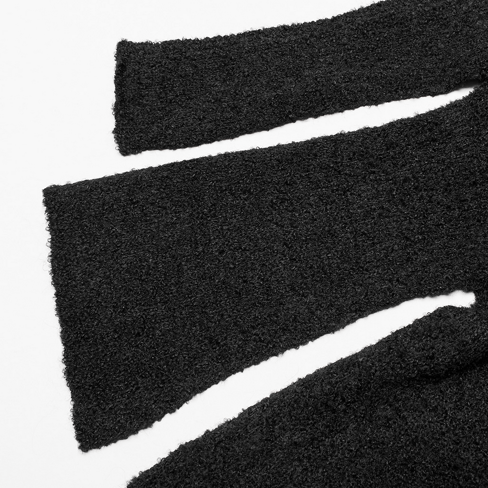 Close-up of the stylish asymmetric sleeves of a chic wool-blend cardigan, showcasing texture and elegant design.