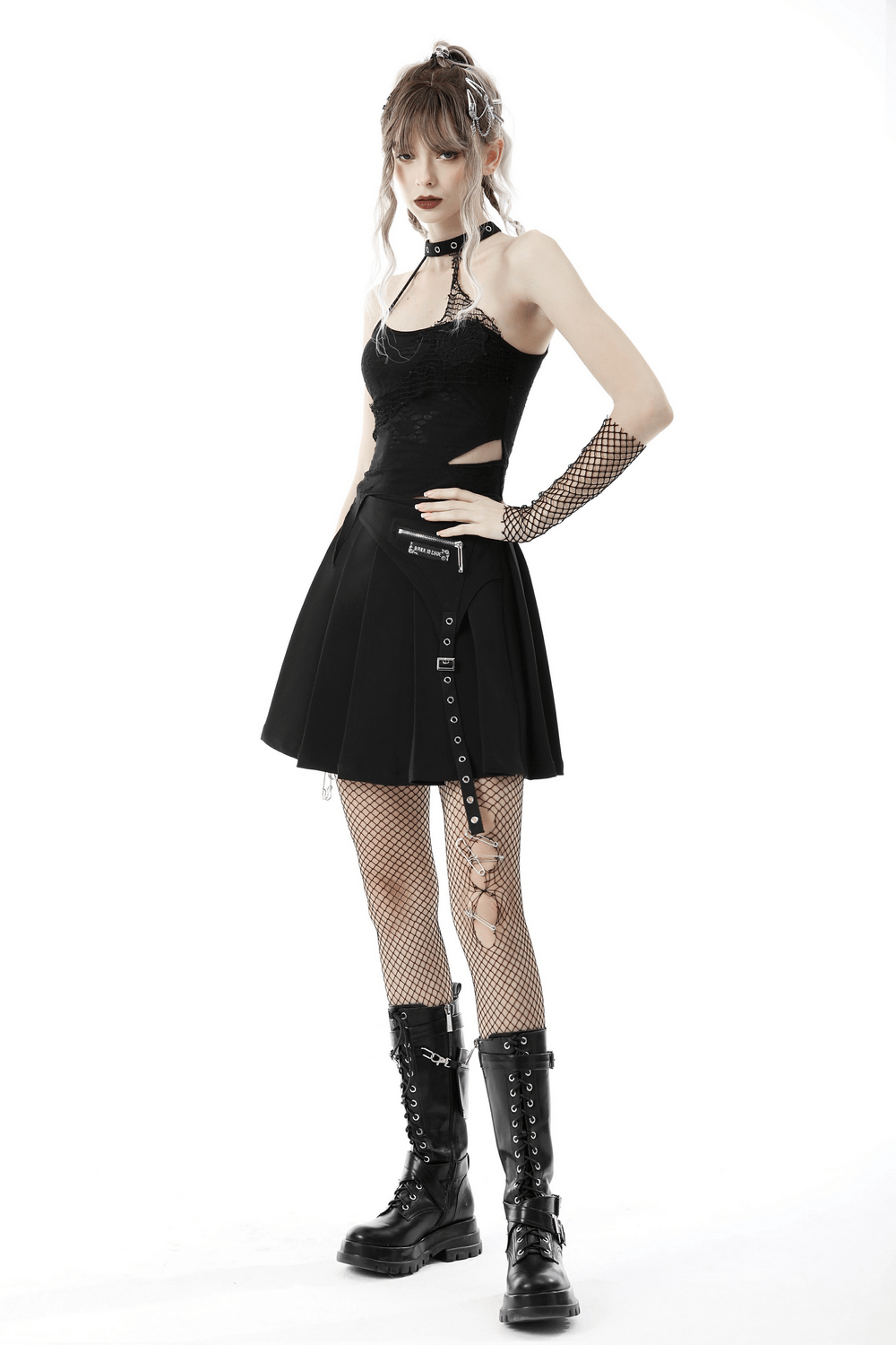 Chic asymmetrical halter top with lace detail, paired with a stylish skirt and fishnet tights for a striking evening look.