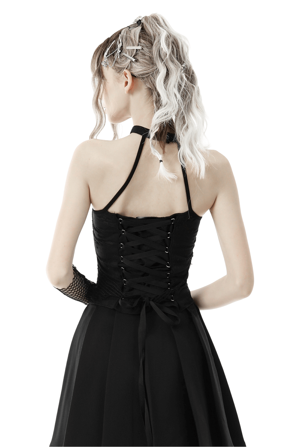 Back view of a chic asymmetrical halter top with lace-up detailing, perfect for a fashionable evening look.