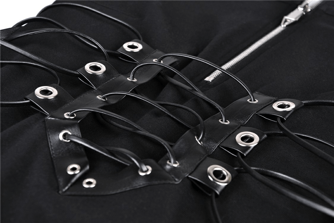 Close-up of lace-up corset detail with grommet accents on a chic black dress, showcasing edgy style.