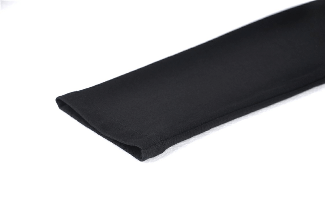 Close-up of a sleek black fabric sleeve, showcasing a smooth texture and elegant folds.