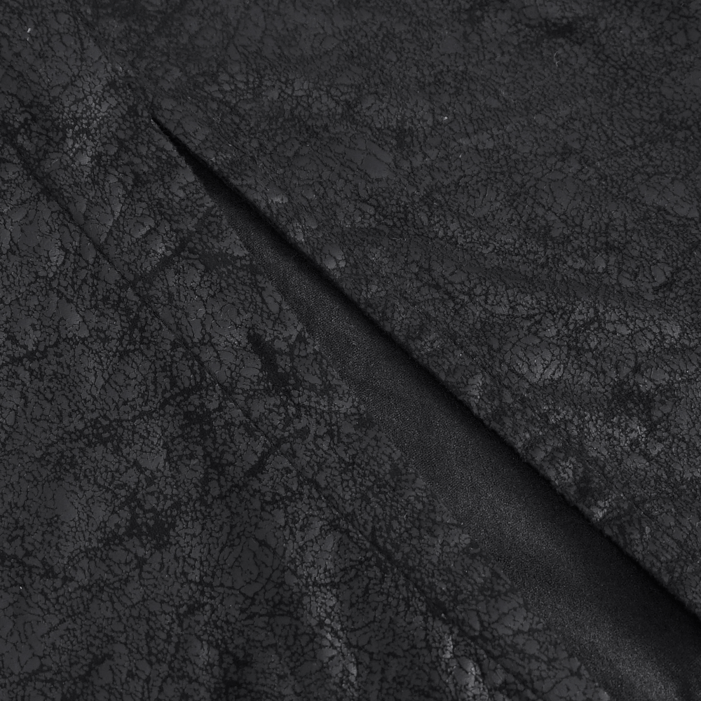 Close-up of black faux leather with a textured surface, perfect for a gothic skirt.