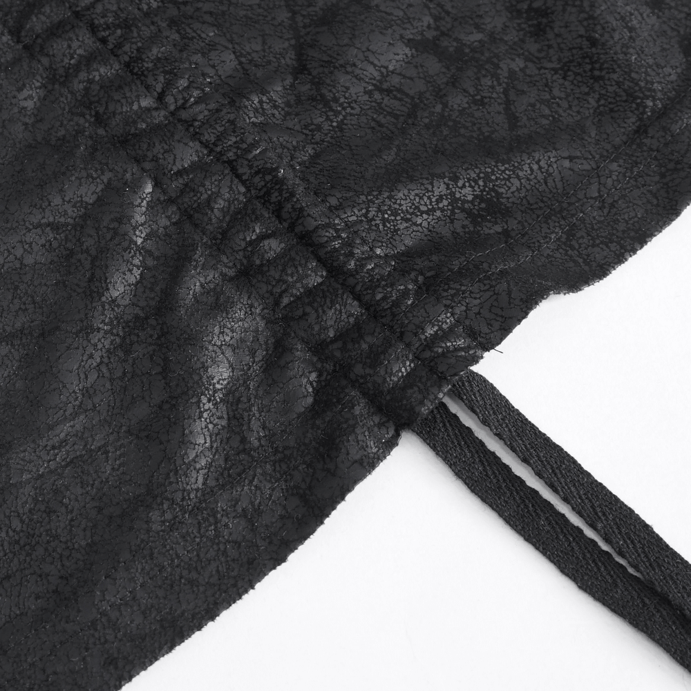 Close-up of the textured black faux leather with gathered elastic and straps for a gothic long skirt.