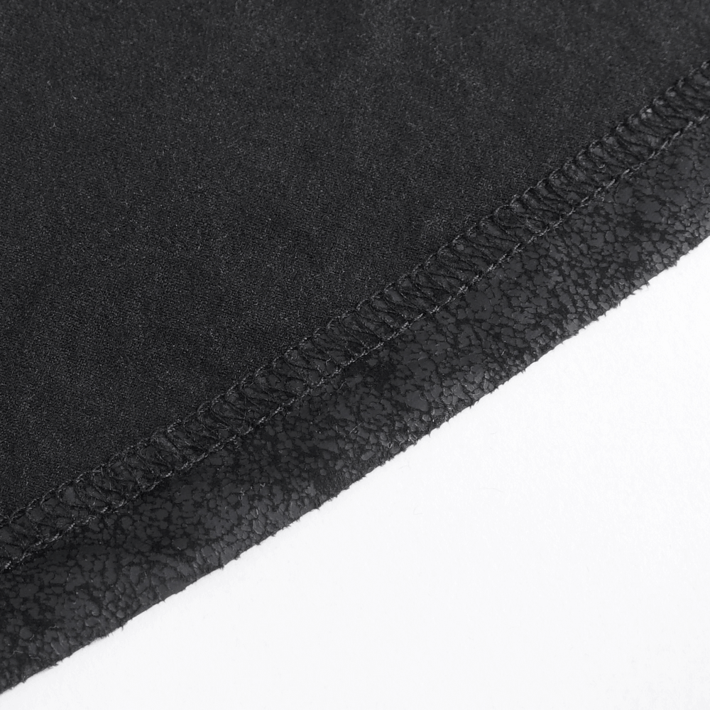 Close-up of the textured hem on a chic black faux leather long skirt, showcasing its edgy design details.
