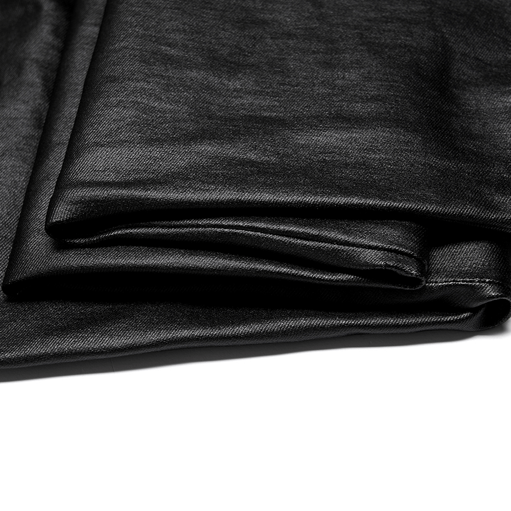 Chic black faux leather fabric folded, showcasing smooth texture for trendy skinny pants.