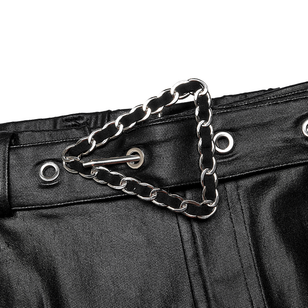 Close-up of the trendy triangle chain detail on chic black faux leather skinny pants waistband.