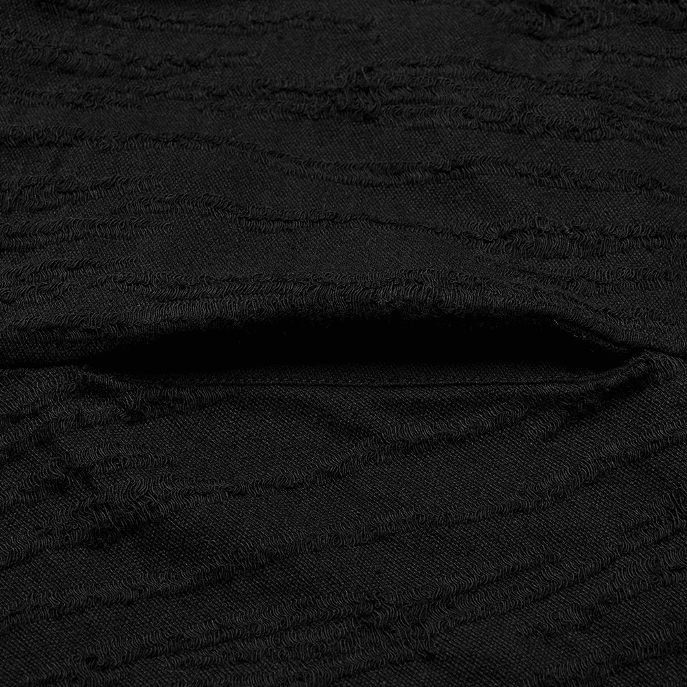 Close-up of the ripped knitted fabric used in a chic black gothic coat; showcasing unique texture and detail.