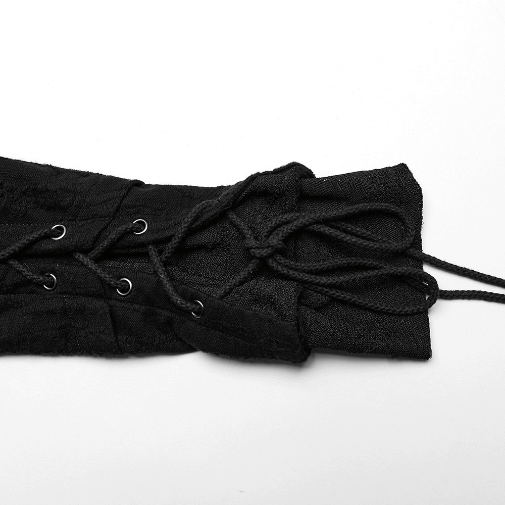 Black laced sleeve detail of a goth long coat, featuring adjustable cords for a customized fit.