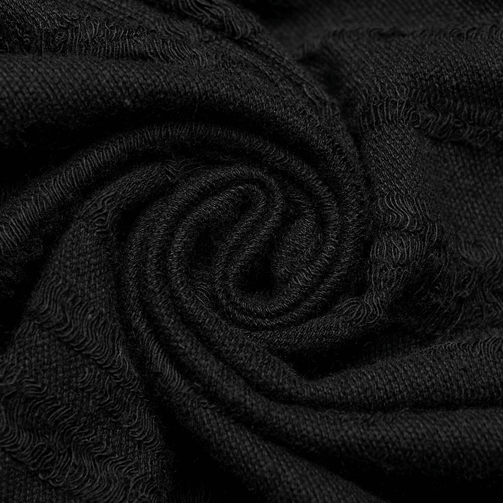 Close-up of soft black knitted fabric, showcasing a textured swirl perfect for gothic style clothing.