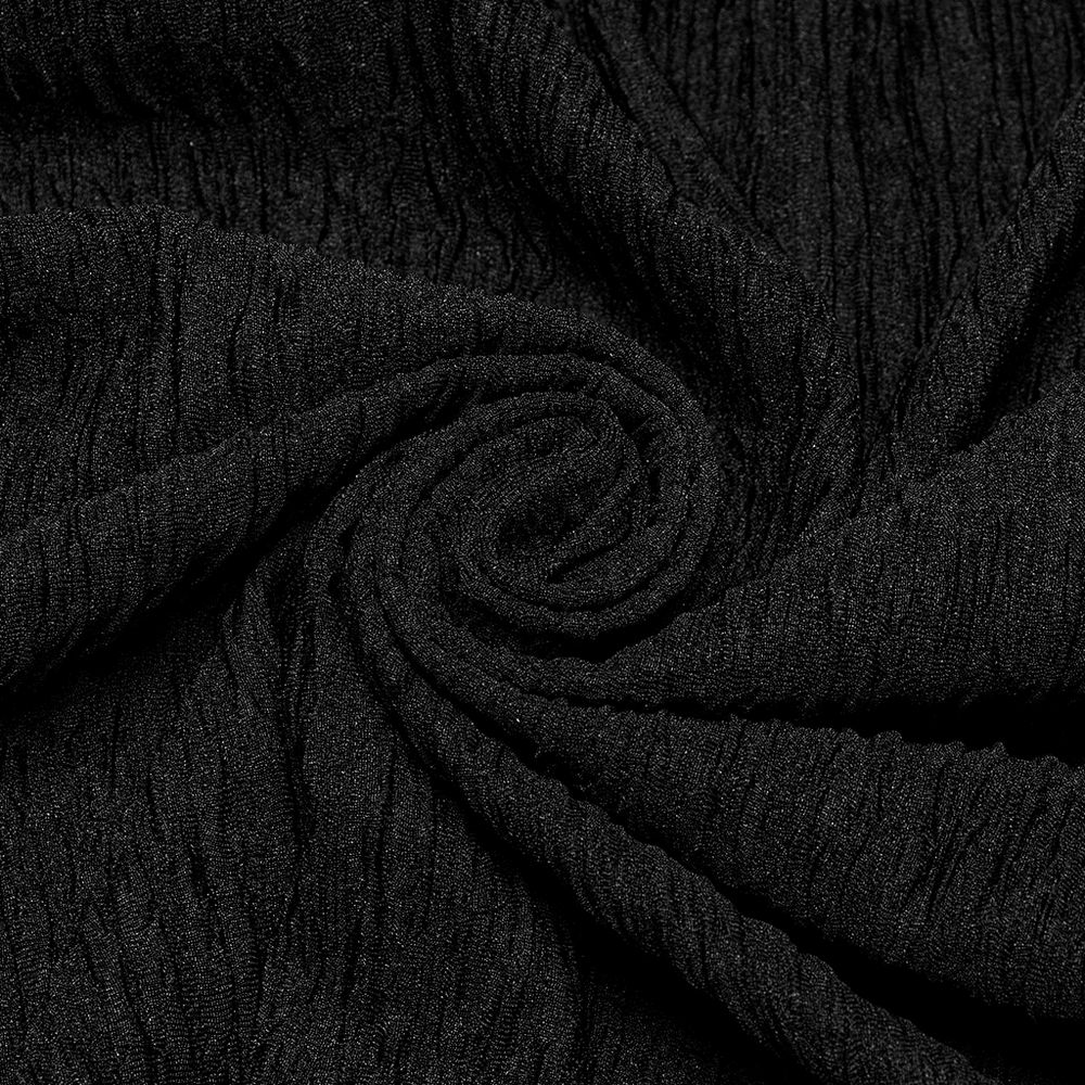 Close-up of chic black knit fabric, showcasing its elastic texture and soft feel, perfect for layering in women's fashion.