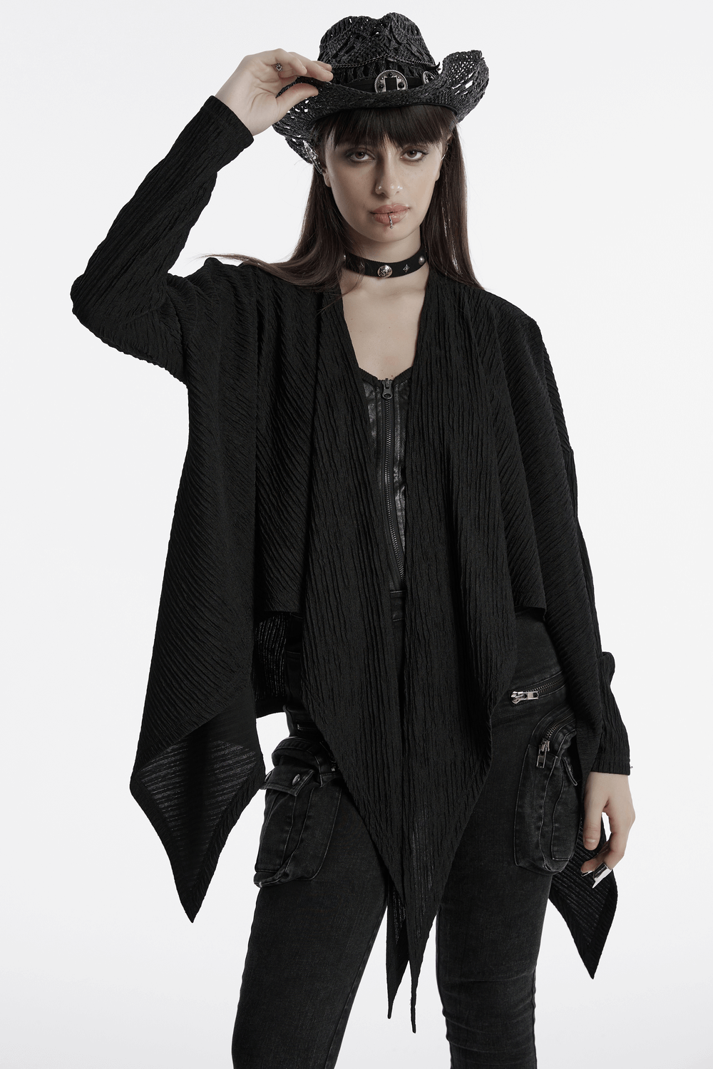 Chic black knit fashion cape for women, featuring an irregular hem and stylish layering for punk-inspired looks.