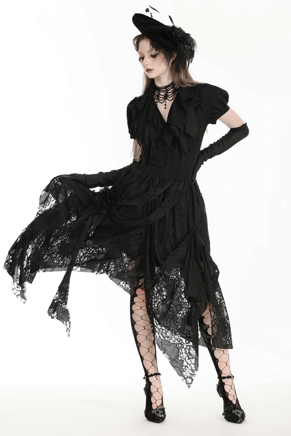 Model in a chic black lace asymmetrical gothic skirt, exuding edgy elegance with a stylish hat and gloves.