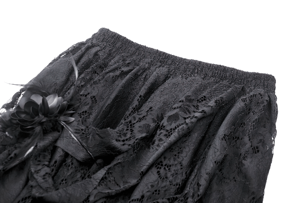 Chic black lace asymmetrical skirt showcasing intricate lace patterns and edgy elegance for gothic style lovers.