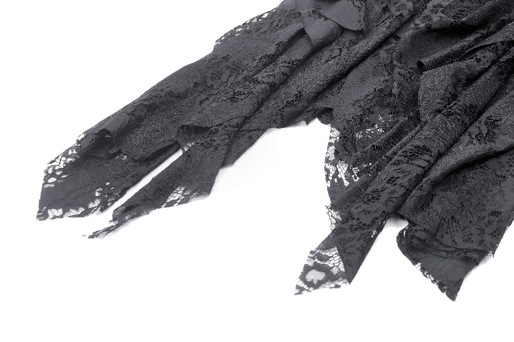 Close-up of delicate black lace fabric showcasing intricate patterns for a gothic-inspired skirt.