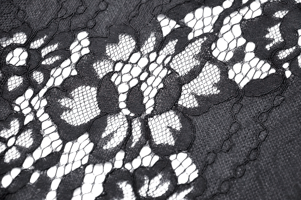 Close-up of intricate black lace fabric featuring floral patterns, perfect for gothic and edgy fashion.