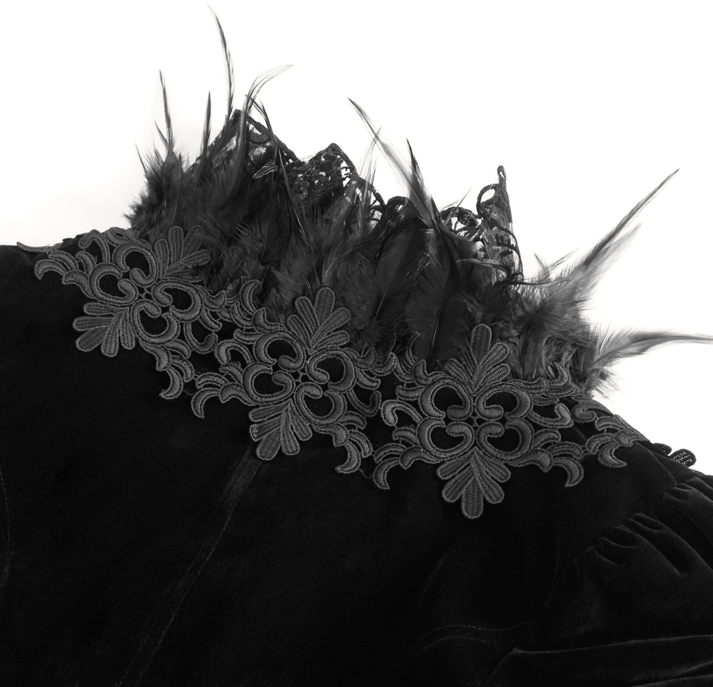 Chic black lace bolero with feather trim and intricate chain accents, perfect for gothic style statements.