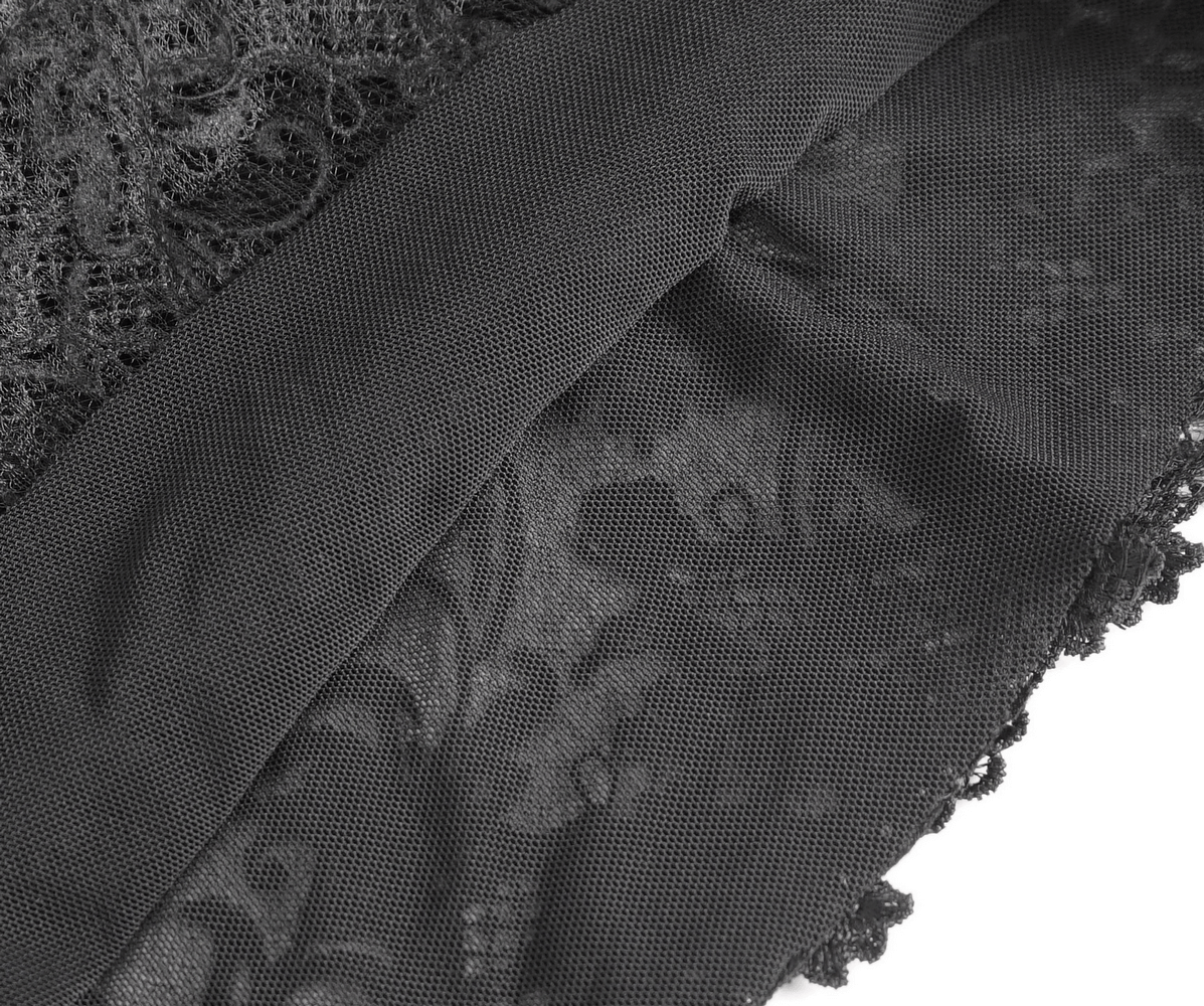 Close-up of black lace fabric showcasing intricate patterns and soft texture for gothic fashion.