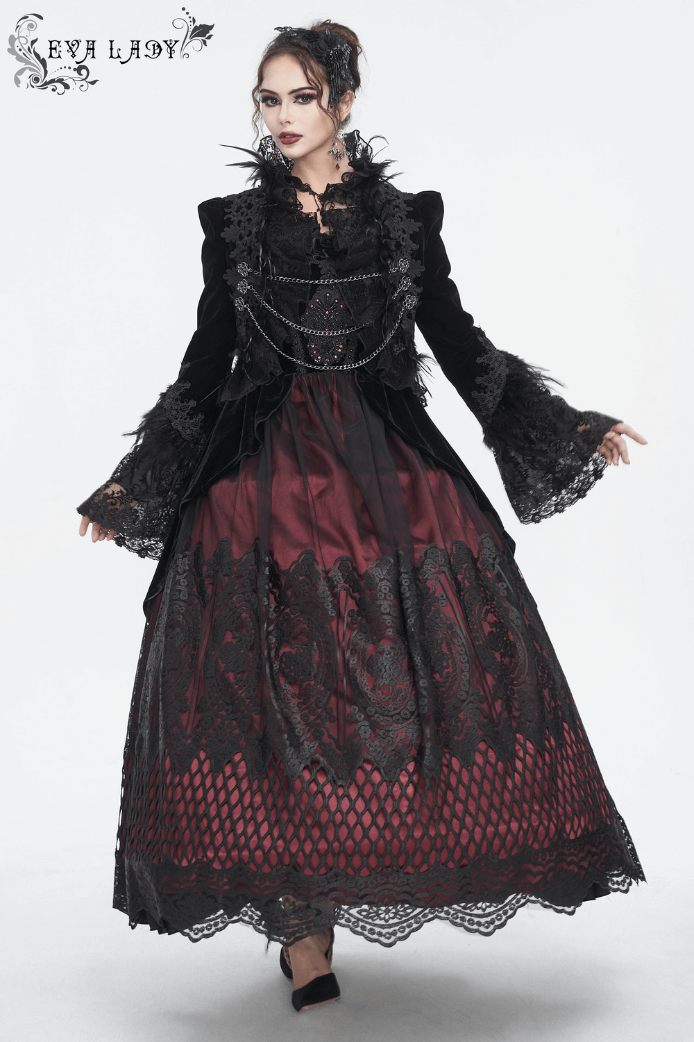 Chic black lace bolero with feathers and chain accents, perfect for gothic elegance in fashion.
