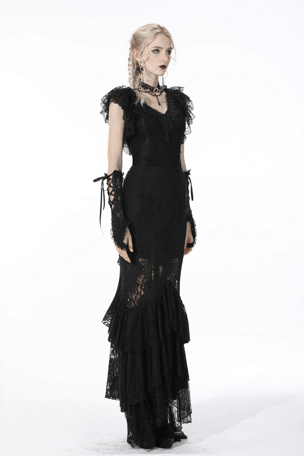 Chic black lace mermaid skirt with layered ruffle hem, paired with matching gloves, embodying gothic elegance.