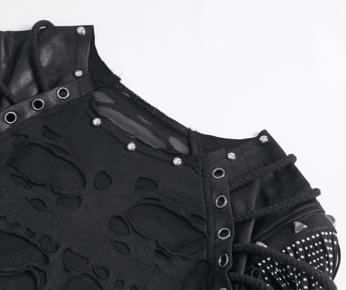 Close-up of edgy black mesh t-shirt showcasing fringe detailing and silver studs, perfect for punk rock style.