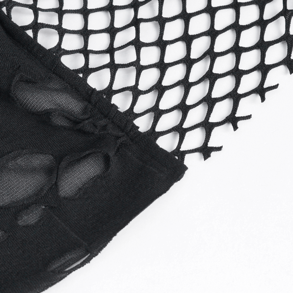 Close-up of black mesh fabric with fringe detailing for edgy street style.