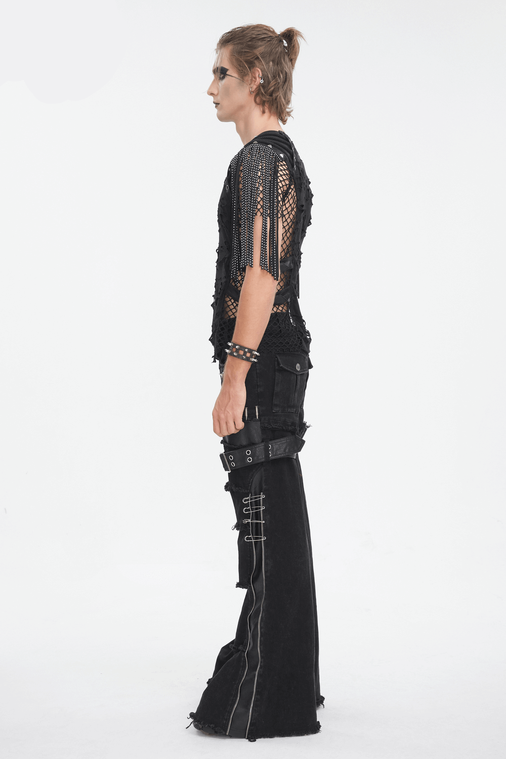Edgy black mesh t-shirt with fringe detailing worn by model, showcasing punk street style.
