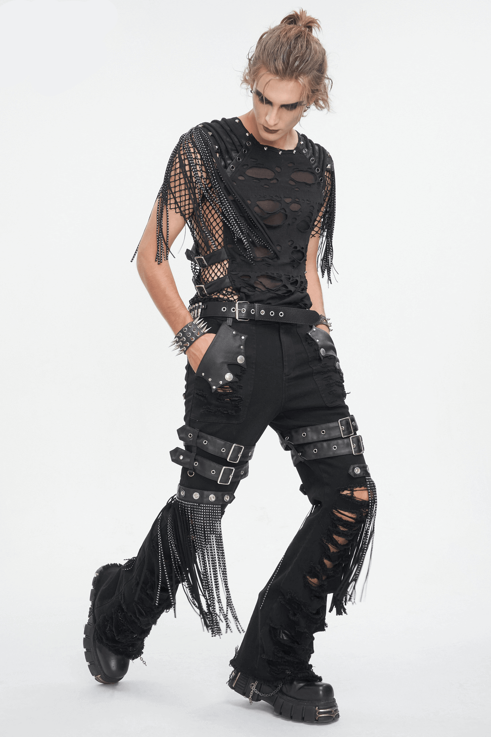 Edgy black mesh t-shirt with fringe detailing worn with ripped black pants, showcasing a punk rock style.