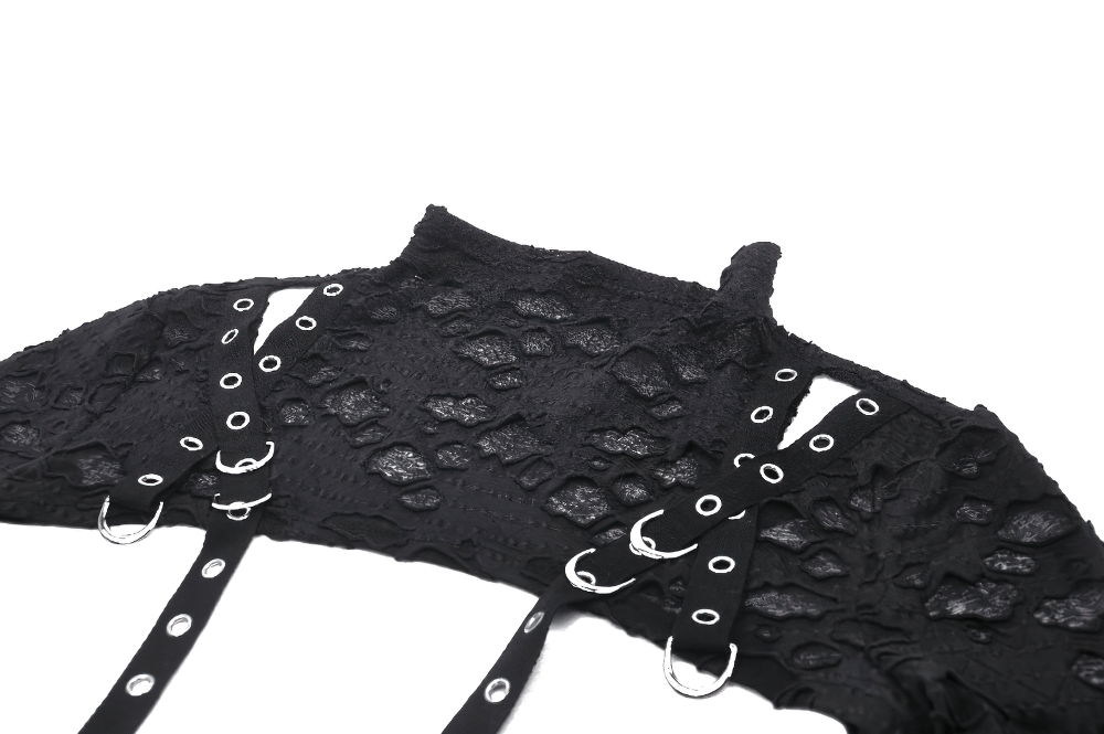 Chic black ripped crop top with metal accents and stylish lace pattern, perfect for bold fashion statements.