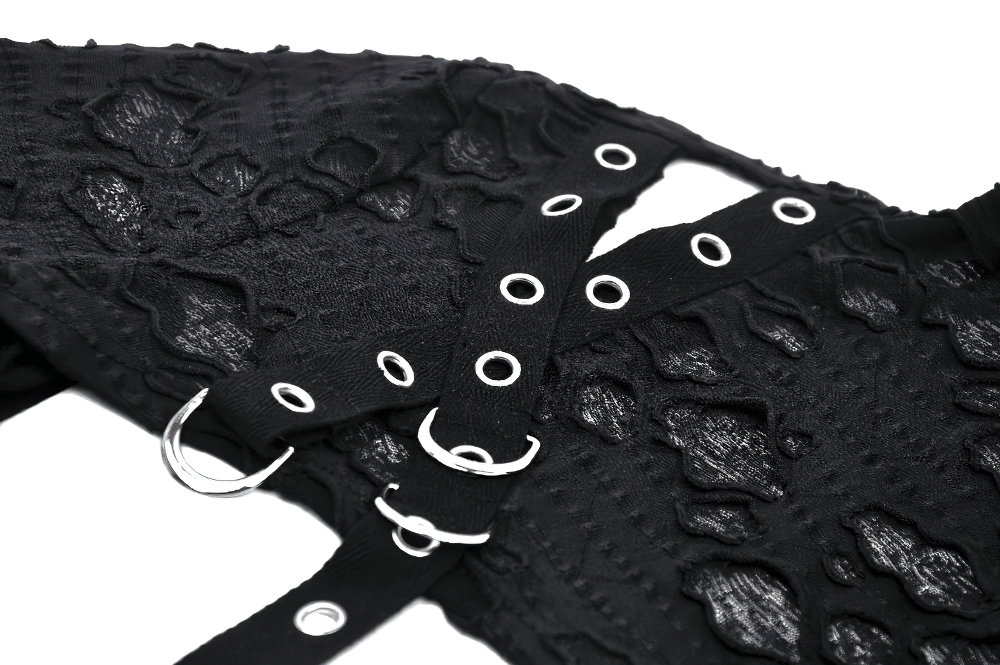 Chic black ripped crop top featuring stylish metal accents and intricate lace details, perfect for bold fashion statements.