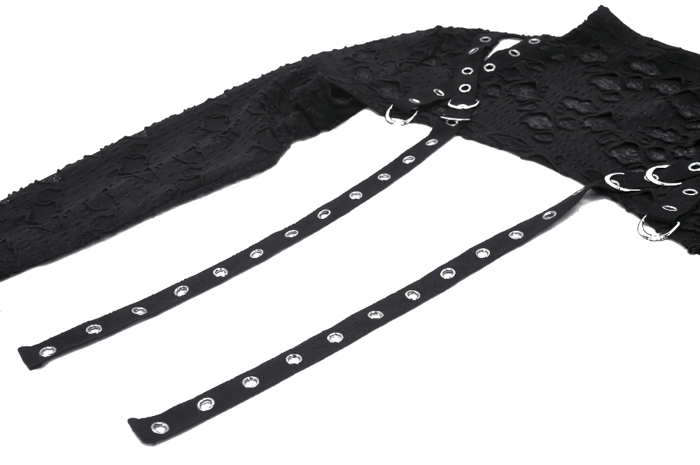 Chic black ripped crop top showcasing intricate lace and stylish metal accents for a trendy look.