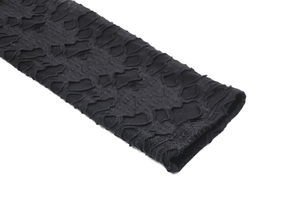 Close-up of a chic black lace fabric with intricate patterns, perfect for a stylish crop top with metal accents.