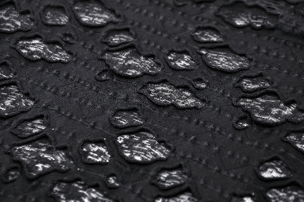 Close-up of stylish black fabric with metallic accents and intricate texture, perfect for chic fashion designs.